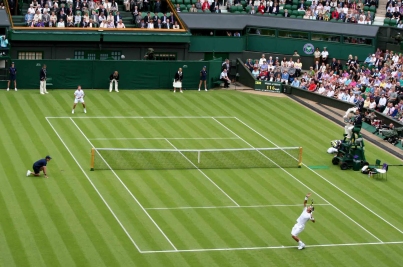Wimbledon is famous for it's playing surface and strict dress code.